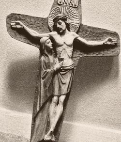 A crucifix with Jesus and Mary
