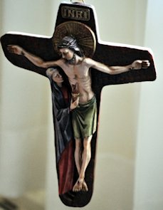 Jesus on a crucifix with Mary near him
