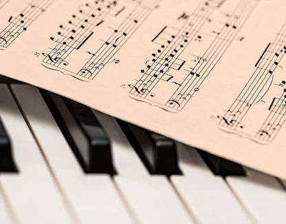 piano keys with sheet music