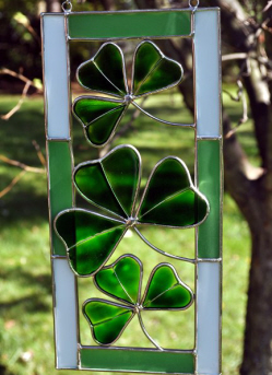 three shamrocks on a stained glass decoration